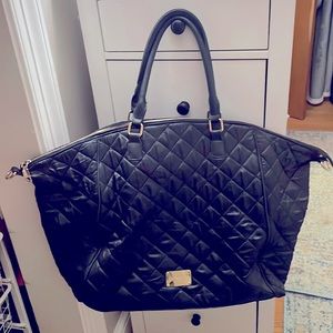 Minimal use. No blemishes / imperfections. But it is missing the shoulder strap.